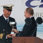 The captain of Mir accepting his prize from Vladimir Putin